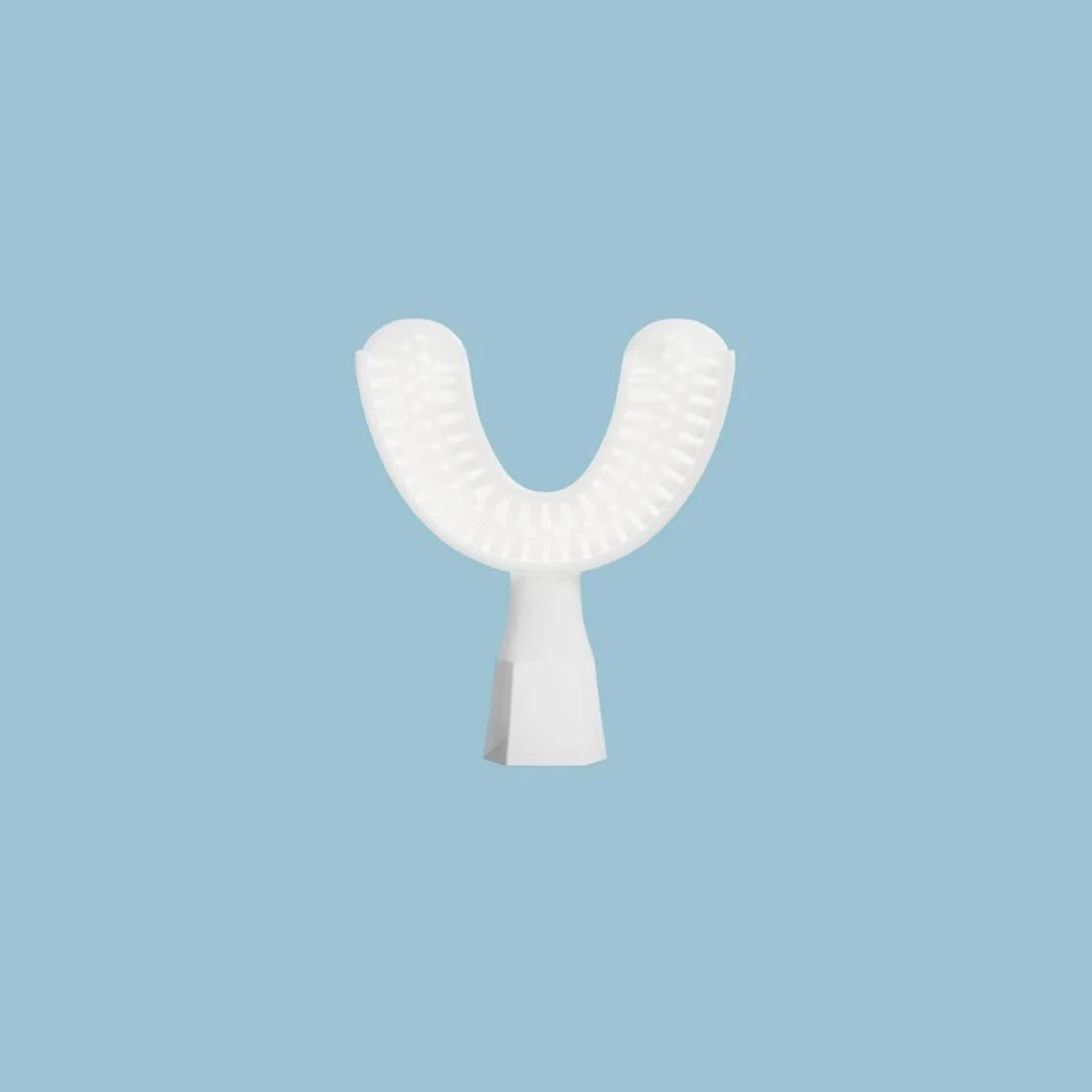 White dental device on a light blue background