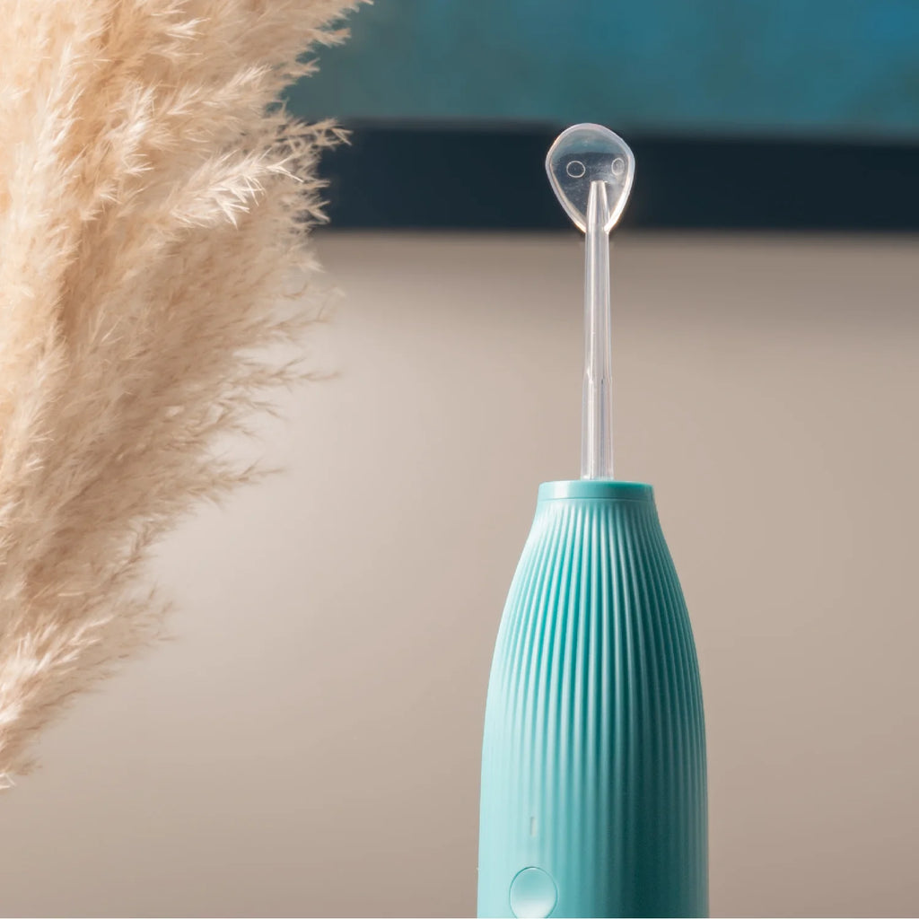 Detailed view of a Hydro-Go Water Flosser with tongue scraper attachement