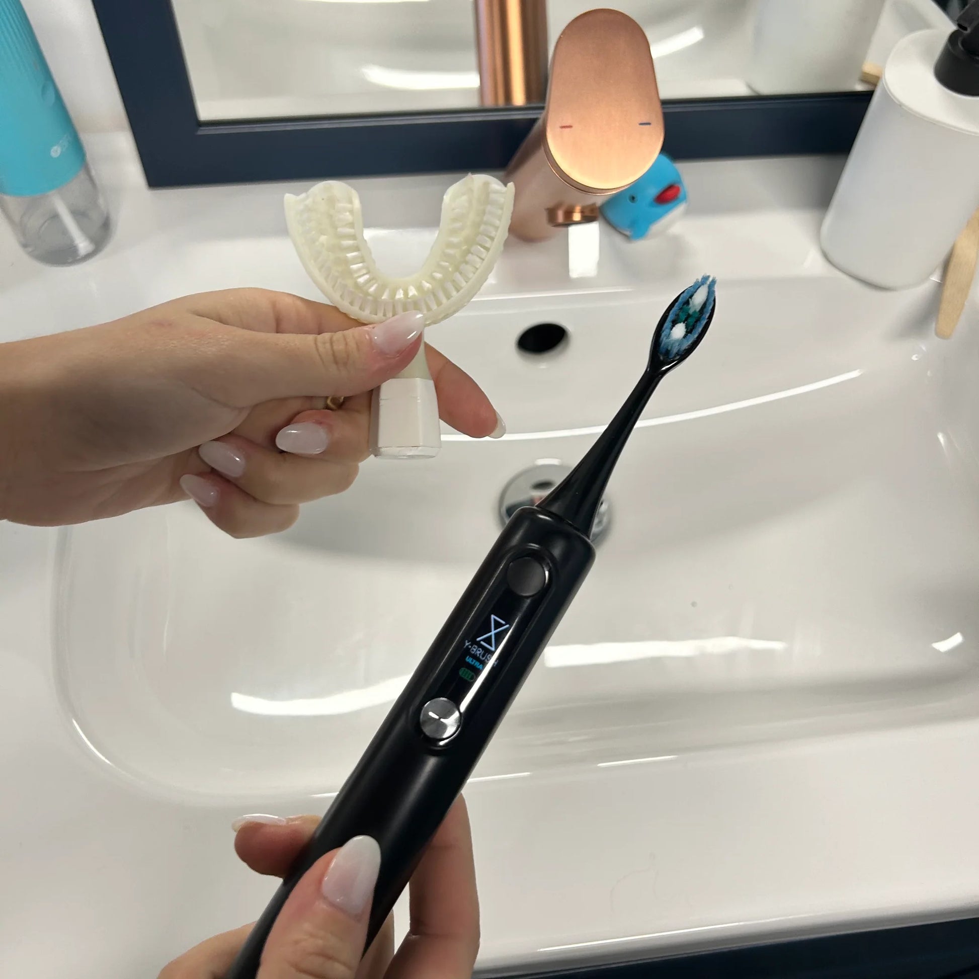 view of how you can switch heads on a Y-Brush Ultra Premium - Electric Sonic Toothbrush for Adult with accessories